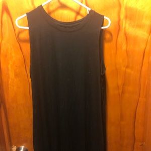 Mid length black sleeveless dress with pockets